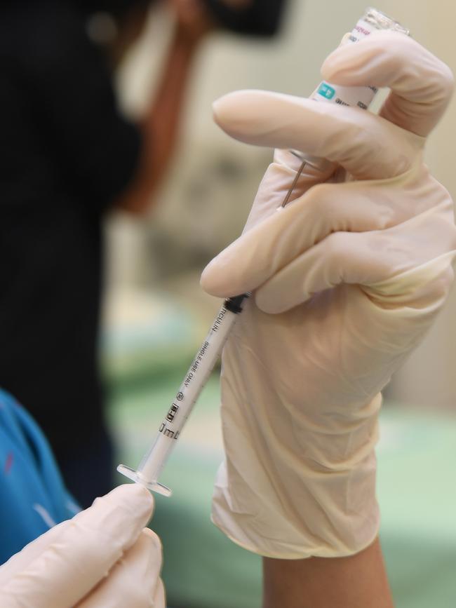 Chief Minister Michael Gunner receives his first dose of the COVID-19 vaccine. Picture: Katrina Bridgeford