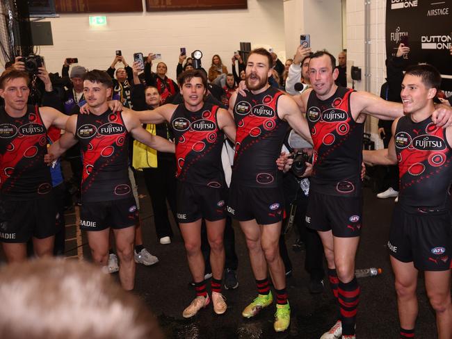 The Bombers celebrate their victory, which propelled them into the top eight.