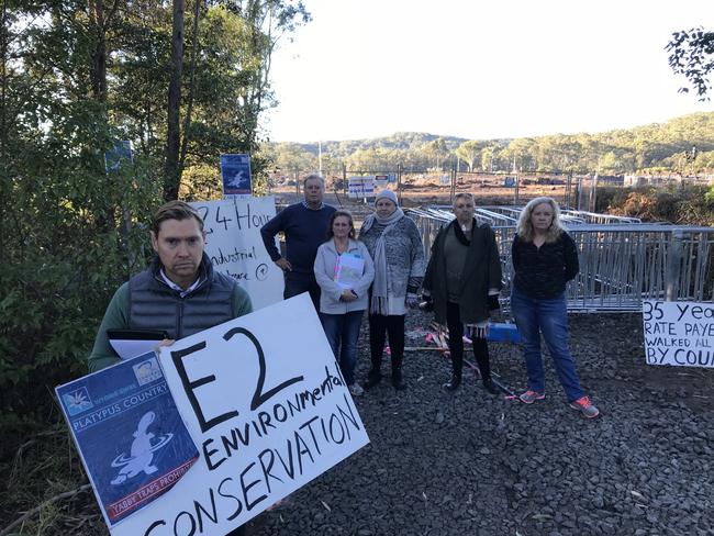 Kangy Angy: Daniel Biancardi holds a protest sign, with other protesters, at the Kangy Angy Rail facility site.