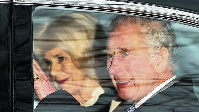 Britain's King Charles III and Britain's Queen Camilla wave as they leave by car from Clarence House in London after meeting Prince Harry who arrived in London after his father's diagnosis of cancer, which doctors "caught early". Picture: Henry Nicholls/ AFP