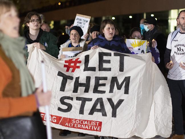 PERTH, AUSTRALIA - JUNE 09:  Members of the public are seen holding signs during a vigil outside the Perth Children's Hospital on June 9, 2021 in Perth, Australia. Three-year-old Tharnicaa, the daughter of the Tamil family from Biloela in Queensland was medically evacuated from detention on Christmas Island to receive medical care in Perth after becoming sick. The family have been detained on Christmas Island since 2019. (Photo by Matt Jelonek/Getty Images)