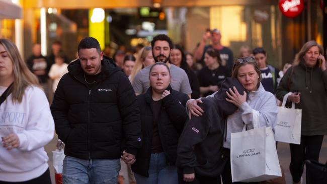 Hundreds of people leaving Westfield Marion after the lockdown. Picture: Brett Hartwig