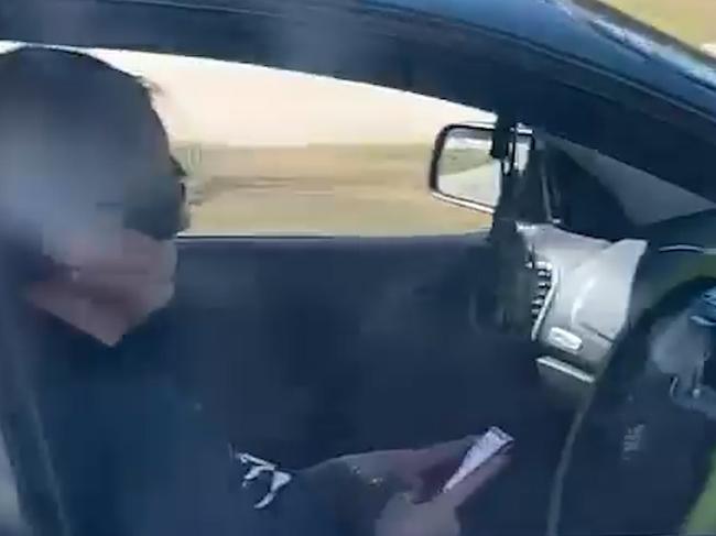 Shocking footage reveals a woman using her phone while driving children along a busy road. Picture: Facebook