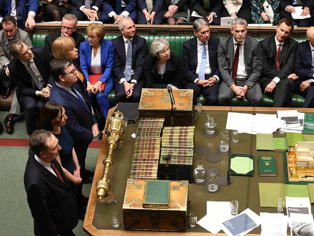 In this image issued by the House of Commons of British Prime Minister Theresa May looks on as MP's announce that she has lost a vote on her Brexit plan Tuesday Jan. 15, 2019. British lawmakers rejected Prime Minister Theresa May's Brexit deal by a huge margin, plunging U.K. politics into crisis 10 weeks before the country is due to leave the European Union. The House of Commons voted 432 -202 on Tuesday against the deal struck between Britain's government and the EU in November.(Mark Duffy, House of Commons via AP)