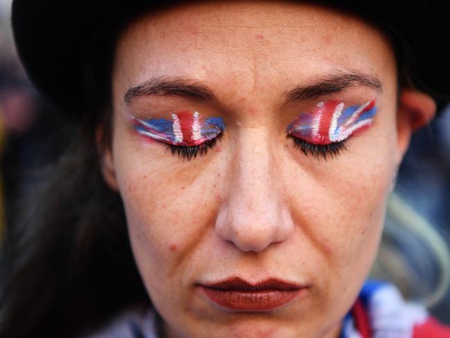 LONDON, ENGLAND - MARCH 29: Protestor 'Million Dollar Lex' attends pro Brexit rally in Parliament Square on March 29, 2019 in London, England. Today pro-Brexit supporters including the March To Leave joined together to protest at the delay to Brexit on the very day the UK and Northern Ireland should have left the European Union.  Former UKIP leader Nigel Farage addressed the crowd along with Members of the European Parliament and other high profile Brexiteers. At the same time MPs voted against the Prime Minister's Brexit deal for the third time. (Photo by Leon Neal/Getty Images) *** BESTPIX ***