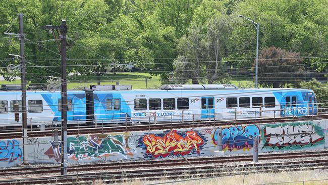 Pointless scrawls mar the rail corridor through Melbourne’s sporting precinct. Picture: Alex Coppel