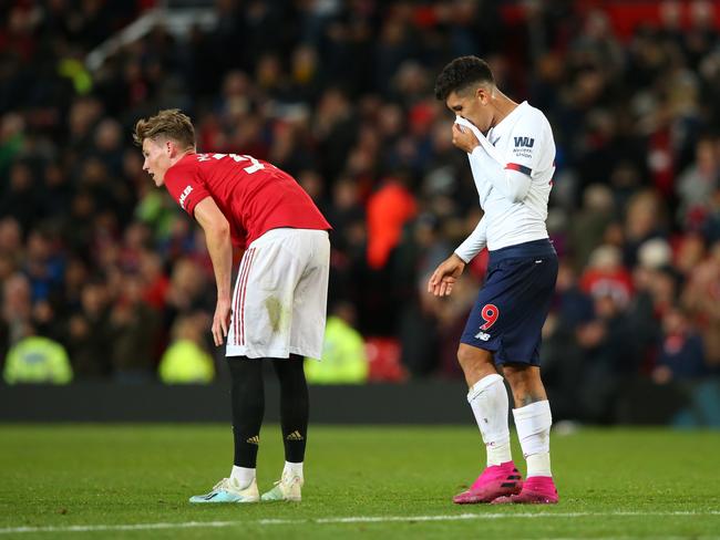 MANCHESTER, ENGLAND - OCTOBER 20: Scott McTominay of Manchester United and Roberto Firmino of Liverpool react at the final whistle during the Premier League match between Manchester United and Liverpool FC at Old Trafford on October 20, 2019 in Manchester, United Kingdom. (Photo by Alex Livesey/Getty Images)