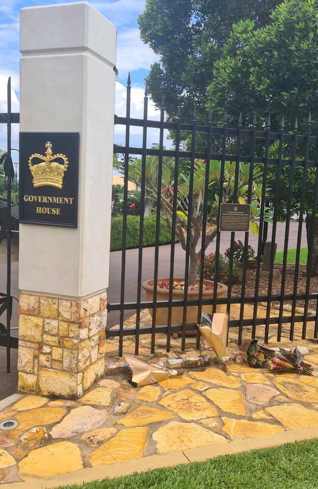 Flowers have been left out the front of Government House in Darwin. Picture: Thomas Morgan