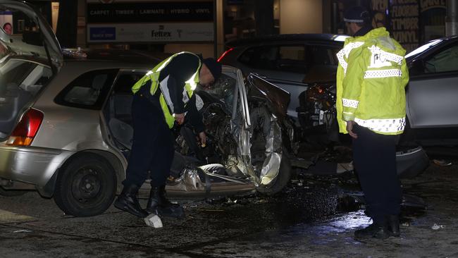 Police and accident investigators on the scene of a fatal car accident on Canterbury Road near Punchbowl. Picture: John Appleyard