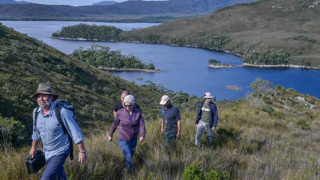 Guide Peter Marmion walking tourists up Balmoral Hill at Port Davey. Picture: Chris Crerar