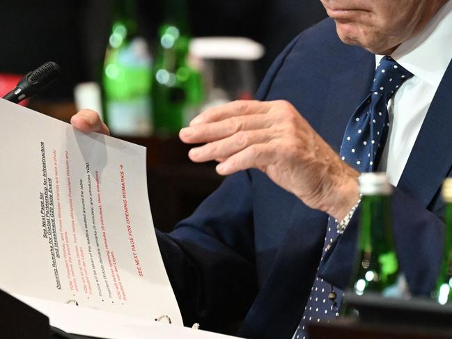 The US President flashed a look at his notes for the meeting. Picture: Saul Loeb/AFP