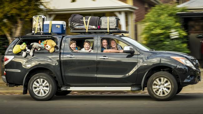 Russell and Kathryn Eaton, with twins Cooper and Jasper, 10, are on the road again at last as South Australia lifts internal travel restrictions. Picture: Roy Van Der Vegt