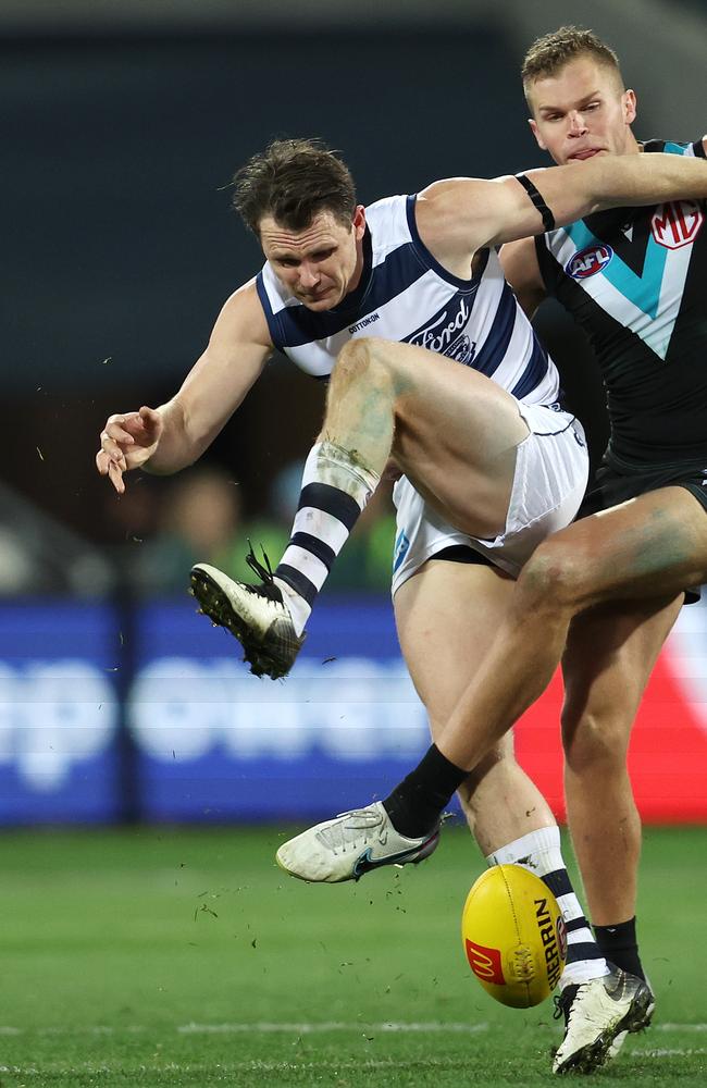 Patrick Dangerfield cops a knock. Picture: Sarah Reed/AFL Photos via Getty Images