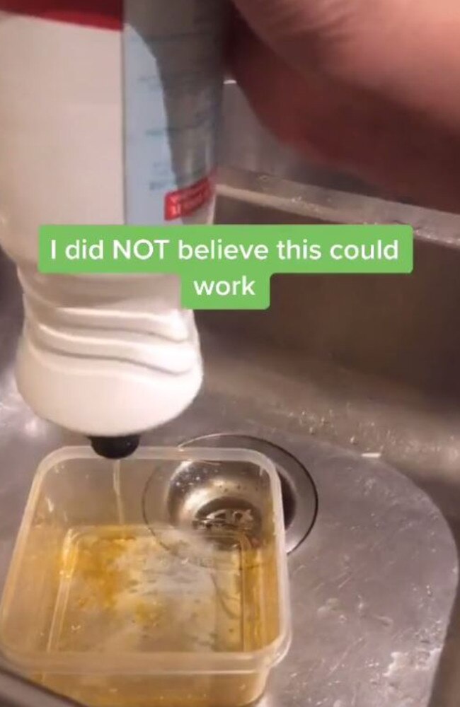 She puts dishwashing liquid and warm water into the container. Picture: TikTok/sharinibeeee