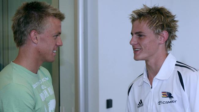 Adelaide’s Nathan Van Berlo, left, welcomes draftee David Mackay to Adelaide in 2006.