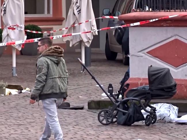 A cordoned off area with a destroyed pram at one of the scenes where a car drove into pedestrians the centre of Trier. Picture: AFP