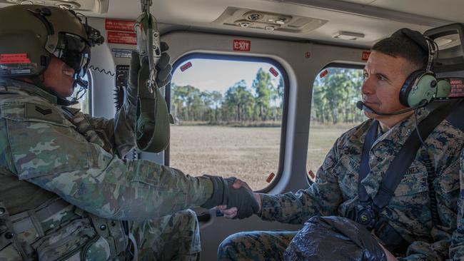 US Marine Corps Major General Benjamin T. Watson (right), the commanding general of 1st Marine Division, shakes hands with a member of the Australian Army before a flight during Exercise Talisman Sabre 23 at Townsville Field Training Area. Picture: Cpl. Emeline Molla