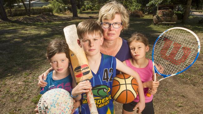 The Erwin family get set to head out of town for their sport - mum Sue with Millie, William and Lucy. Picture: Rob Leeson