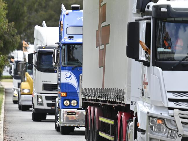 CANBERRA, AUSTRALIA, NewsWire Photos. NOVEMBER 25, 2023: TWU Members and supporters gather in front of Parliament House in Canberra. National truck convoys urge passing of reform as insolvencies soar and 2023 truck crash deaths exceed 200. Picture: NCA NewsWire / Martin Ollman