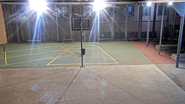 CCTV vision shows a drone dropping contraband into the bucket placed in front of this basketball ring at Parklea jail.