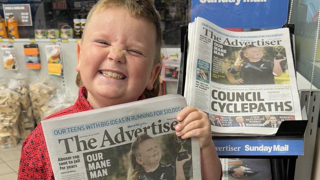 Mullet Cup Winner Ambrose Skyrpek with the front page of The Advertiser on Thursday morning. Picture: Supplied