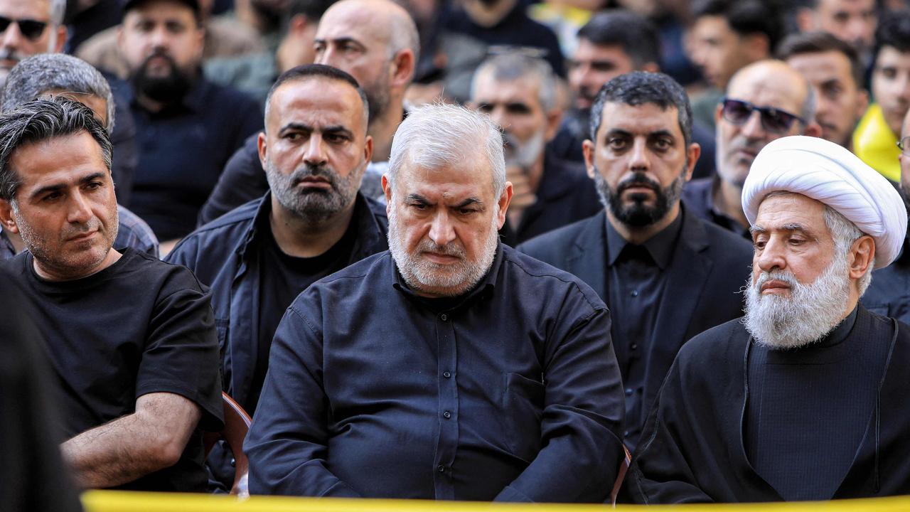 Nail Qassem (right), deputy secretary-general of Hezbollah, and Mohammed Raad (centre), head of Hezbollah's bloc in the Lebanese parliament, attend the funeral of Ibrahim Aqil. Picture: AFP