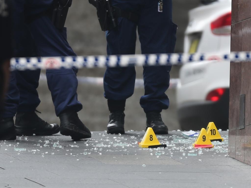 Police forensics at the scene in Martin place after the siege ended at the Lindt cafe . Picture: John Grainger