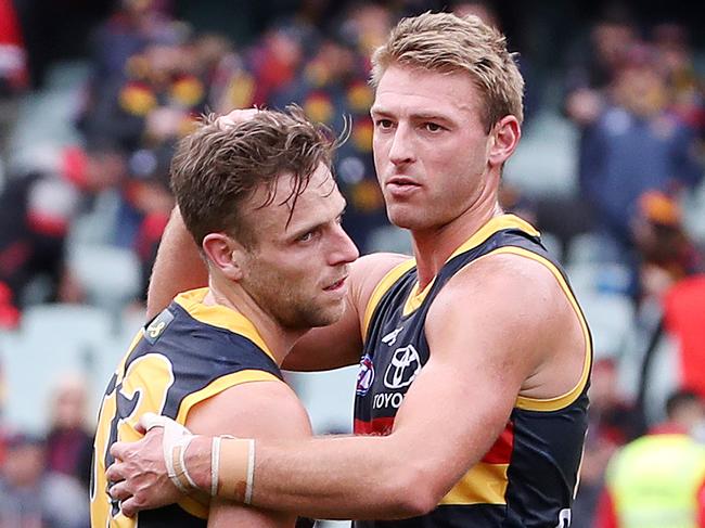 AFL - Sunday, 26th July, 2020 - Adelaide Crows v Essendon at the Adelaide Oval. A shattered Brodie Smith who had a chance at winning the game with a kick at goal on the run - team mate Daniel Talia tries to console him  Picture: Sarah Reed