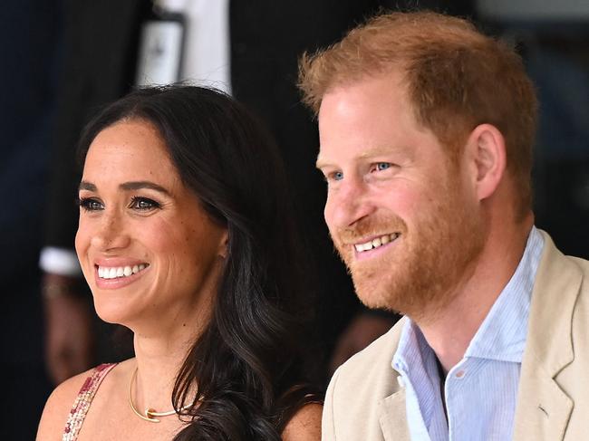 Britain's Prince Harry (R), Duke of Sussex, and his wife Meghan Markle are pictured during a visit to the National Centre for the Arts in Bogota on August 15, 2024. Prince Harry and his wife, American actress Meghan Markle, arrived in Colombia at the invitation of Marquez, with whom they will attend various meetings with women and young people to reject discrimination and cyberbullying. (Photo by RAUL ARBOLEDA / AFP)