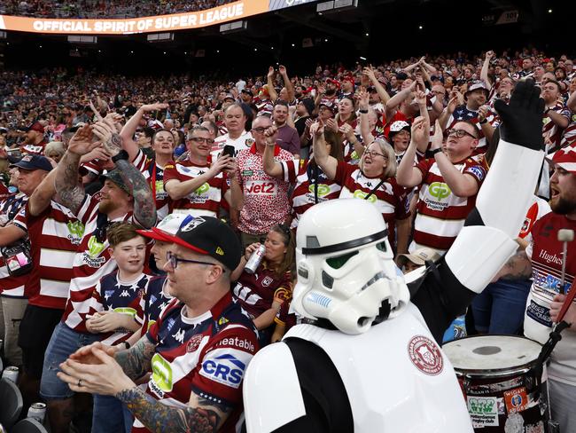 Wigan fans celebrating the win against Warrington. Picture: Jonathan Ng