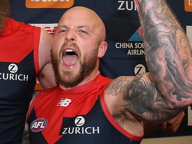 PERTH, AUSTRALIA - AUGUST 19: Max Gawn and Nathan Jones of the Demons celebrate following singing the club song and winning the round 22 AFL match between the West Coast Eagles and Melbourne Demons at Optus Stadium on August 19, 2018 in Perth, Australia.  (Photo by Paul Kane/Getty Images)