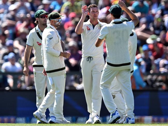 Josh Hazlewood celebrates the wicket of Daryl Mitchell. Picture: Getty