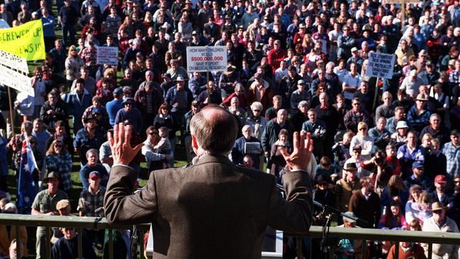 Former Prime Minister John Howard with outline of what appears to be bullet proof vest, tries to placate hostile pro-gun rally in Sale, Victoria. Following the Port Arthur massacre, two federally funded gun buyback and voluntary surrenders resulted in more than a million firearms being collected or destroyed. Picture: Ray Strange