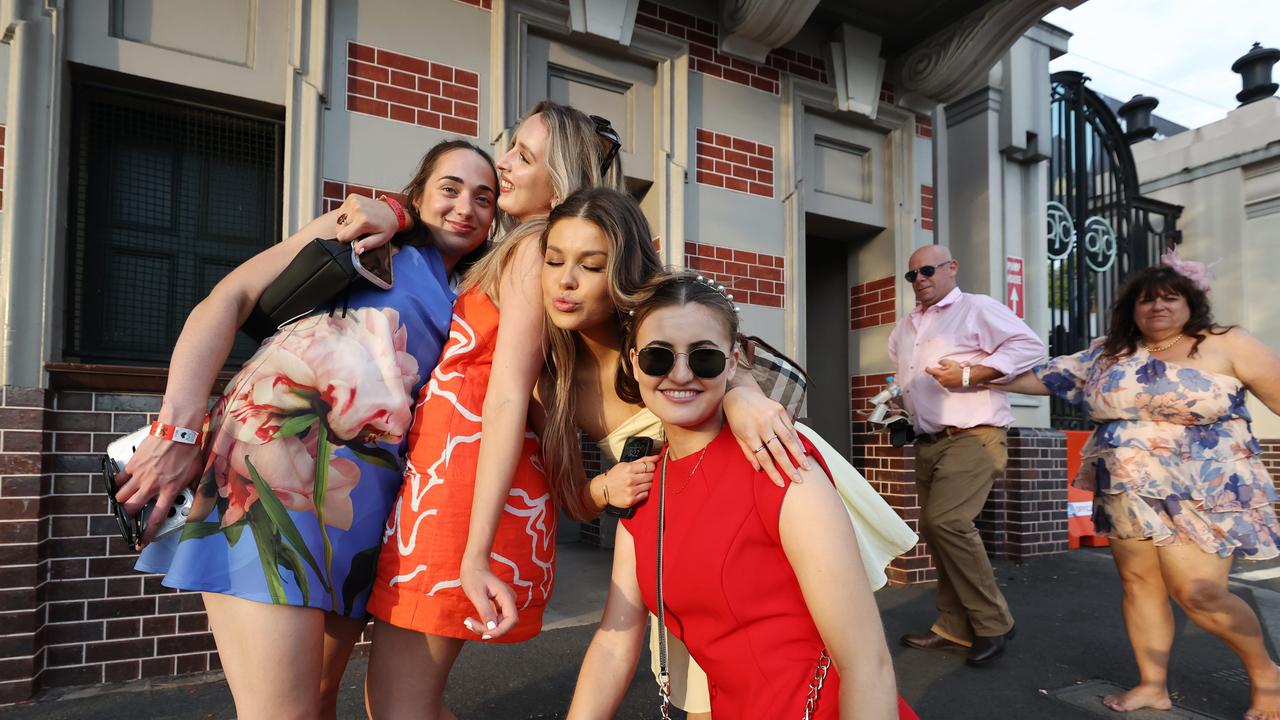 Punters leave Eagle Farm racecourse on Melbourne Cup Day.