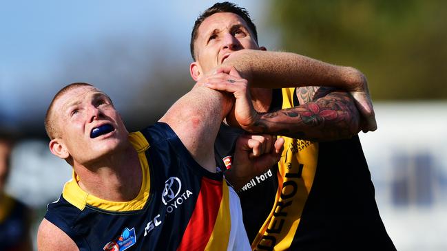 Adelaide ruckman Sam Jacobs and his Glenelg counterpart Jesse White had a great battle at the Bay on Saturday. Picture: Mark Brake/Getty Images