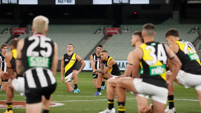 AFL players taking a knee before the game was a meaningful move, writes Susie O’Brien. Picture: Michael Willson/AFL