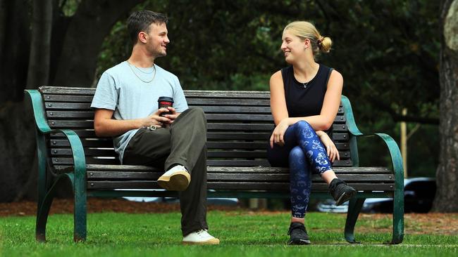 Josh Palmer and Claudia Wilby live with their parents but meet up for a walk on The Tan in Melbourne. Picture: Aaron Francis