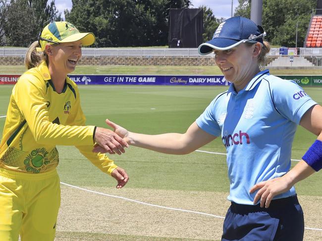 CANBERRA, AUSTRALIA - FEBRUARY 03: Meg Lanning of Australia shakes hands with Heather Knight of England after loosing the toss during game one of the Women's Ashes One Day International series between Australia and England at Manuka Oval on February 03, 2022 in Canberra, Australia. (Photo by Mark Evans/Getty Images)