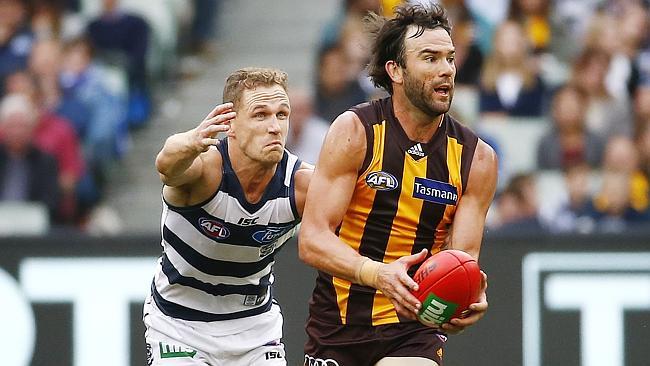 Hawthorn midfielder Jordan Lewis under pressure from Joel Selwood. Picture: Colleen Petch