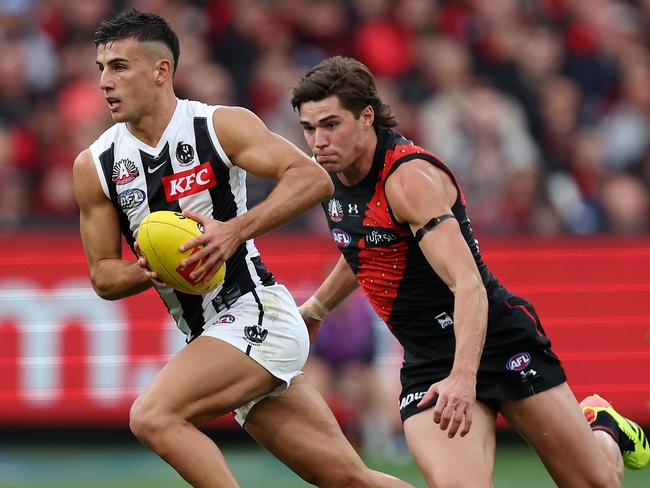 Sam Durham goes after Nick Daicos on Anzac Day. Picture: Mark Stewart