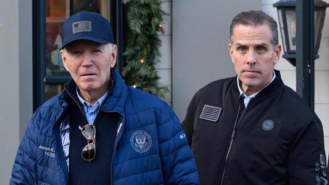 A November 29, 2024 photo shows US President Joe Biden and son Hunter Biden stepping out of a bookstore while shopping in Nantucket, Massachusetts on November 29, 2024. Biden on Sunday issued an official pardon for his son Hunter, who is facing sentencing for two criminal cases related to tax evasion and the purchase of a firearm. (Photo by Mandel NGAN / AFP)