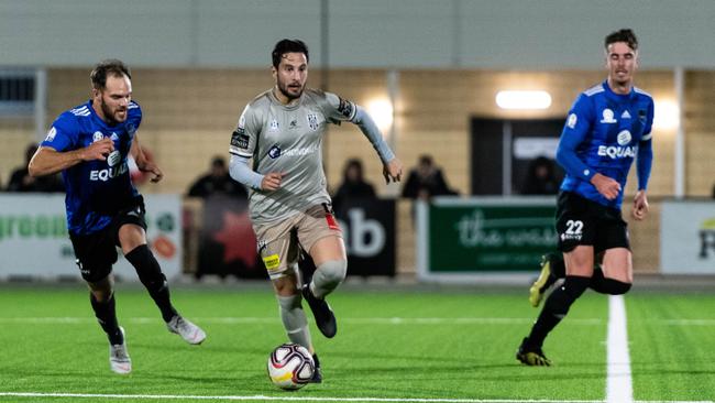 Adelaide City's Nicholas Bucco in action against Comets at Jack Smith Park on Friday night. Picture: Ben Verringer 