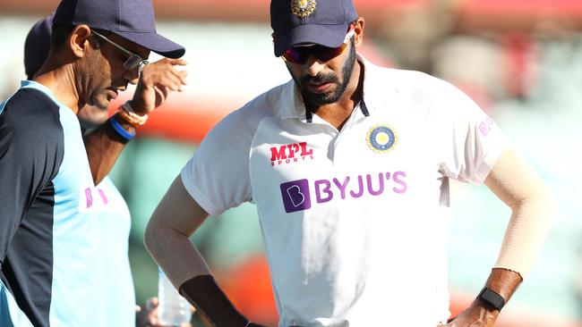 Indian fast bowler Jasprit Bumrah speaks to a member of the team’s staff as he fields on the boundary during day three of the Third Test at the SCG. Picture: Getty Images