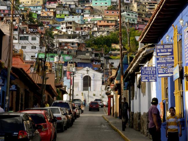 The colourful streets of Caracas look picturesque, but they hide a dark reality. Picture: Nick Farrell