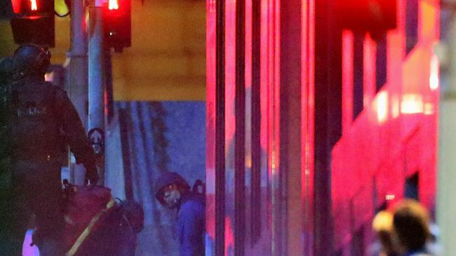 Armed police outside the cafe as the siege nears its end. Photo: Getty Images