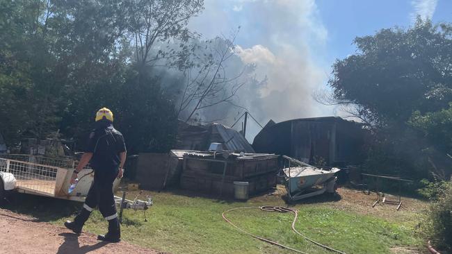 Queensland Fire Department crew member inspects the Roseneath blaze. Picture: Leighton Smith.