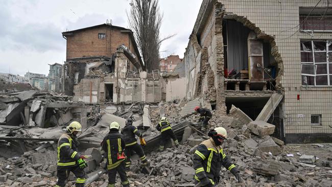 Ukrainian rescuers work at the site of a missile attack in Kyiv on March 25, 2024. Picture: Sergei Supinsky/AFP