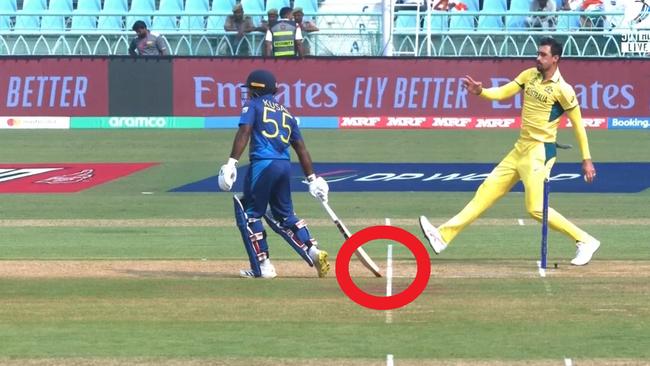 Mitchell Starc warns Perera to not leave his crease early.