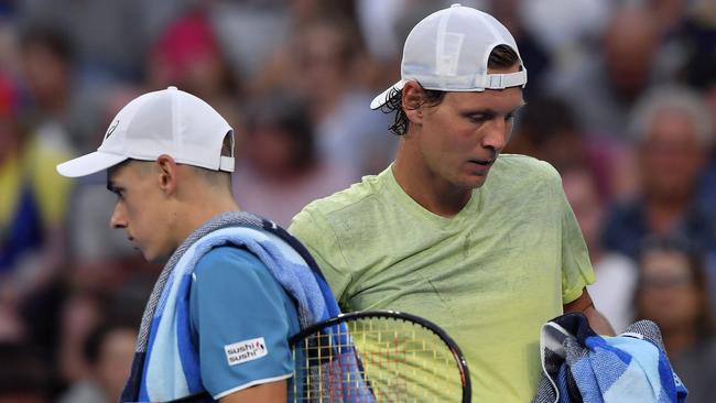 Generation not quite next: Tomas Berdych and Alex De Minaur cross paths.