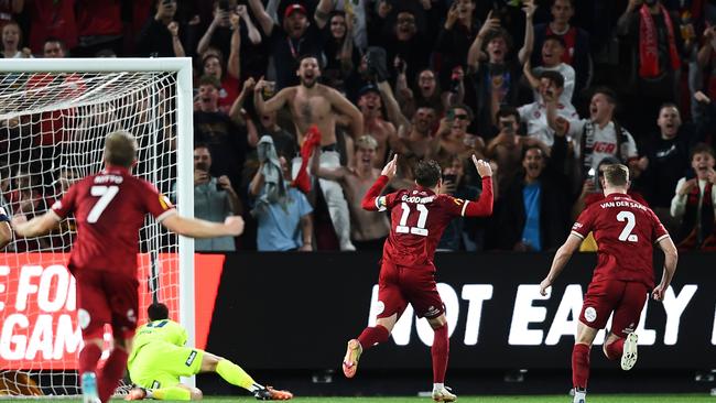 Socceroo Craig Goodwin (centre) celebrates scoring for Adelaide United. Picture: Mark Brake/Getty Images